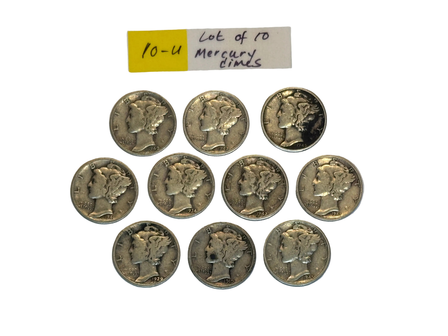 Collection of Mercury dimes on a white background with a label indicating 'lot of 10'.