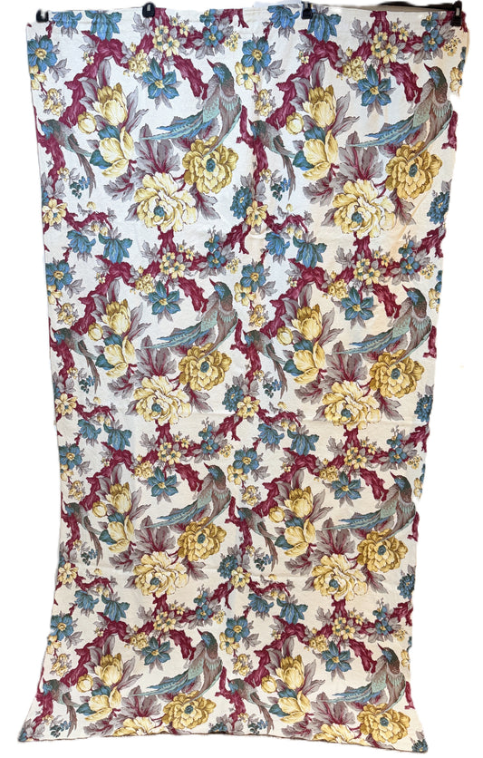 Floral and bird patterned 1940s bark cloth fabric with a white background