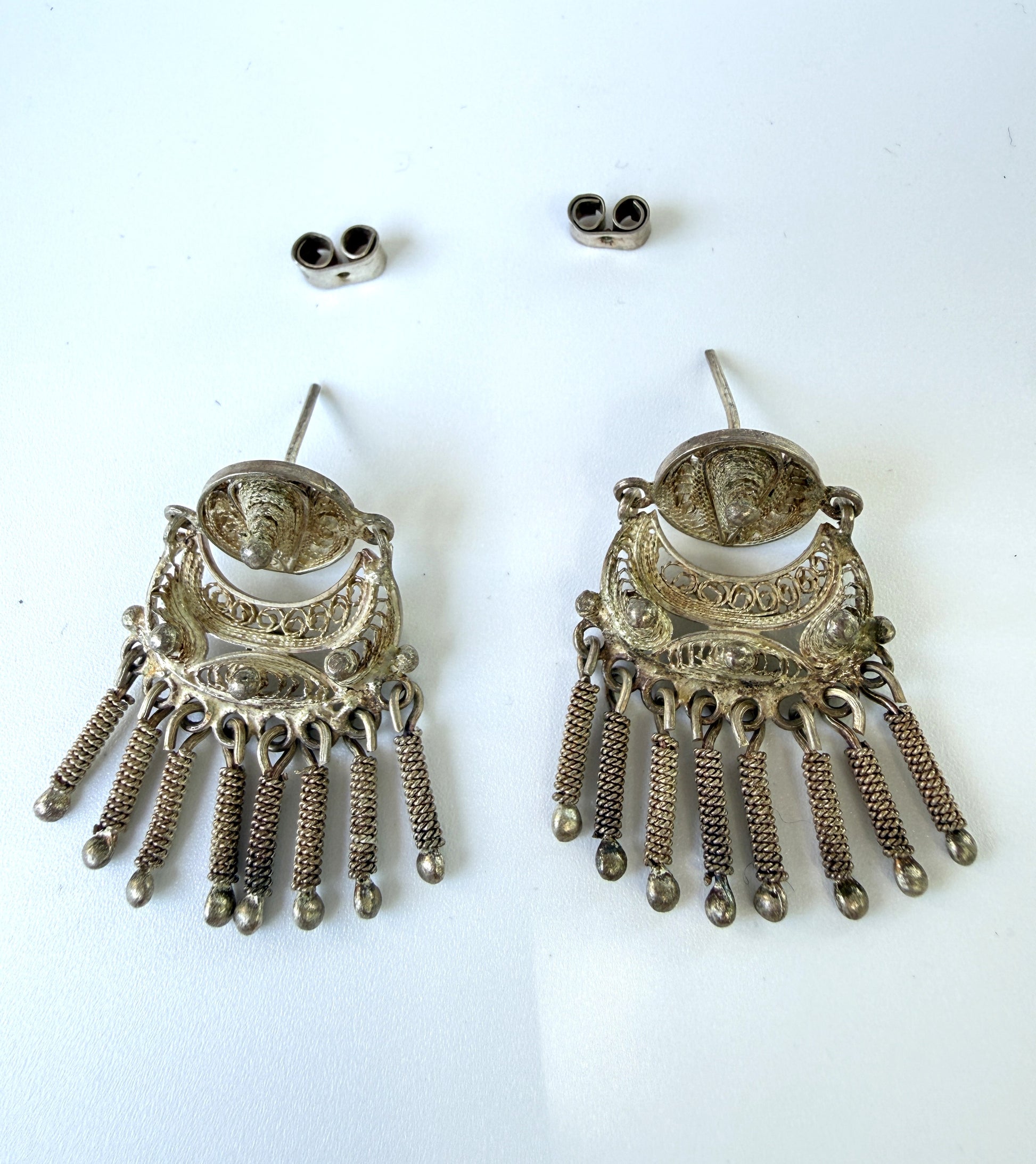 Pair of silver earrings with fringe design