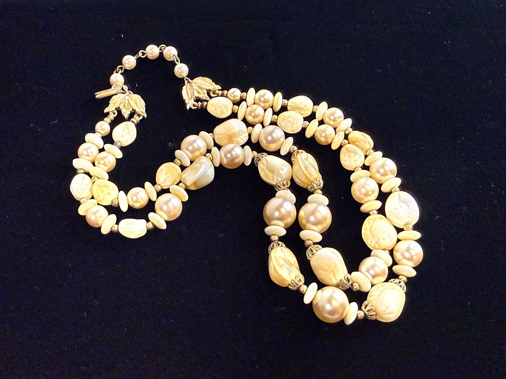 A multi-strand vintage Trifari baroque pearl art glass necklace with gold-toned metal accents
