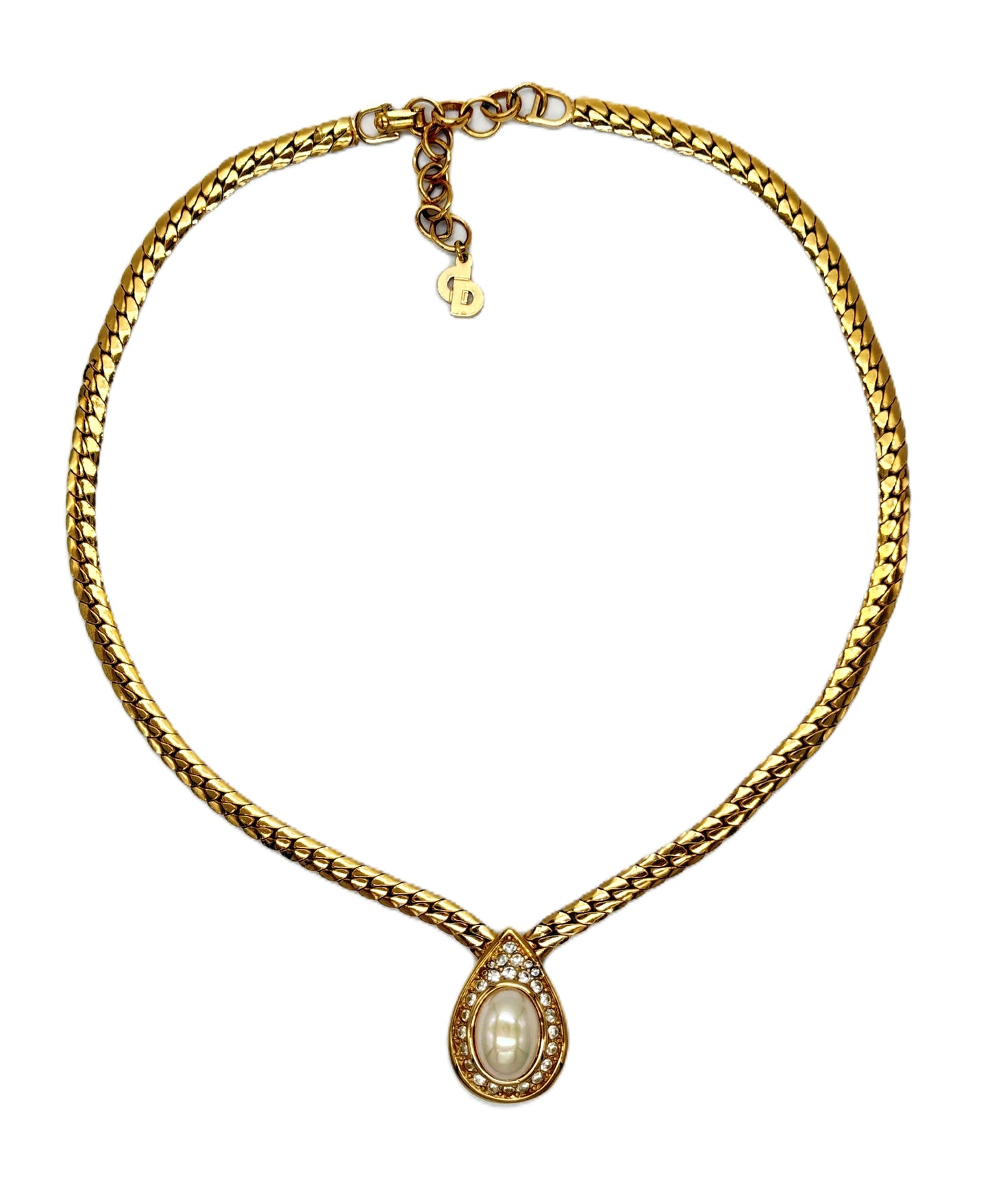 A Christian Dior gold chain necklace with a teardrop-shaped pendant featuring a central white pearl surrounded by small crystal stones